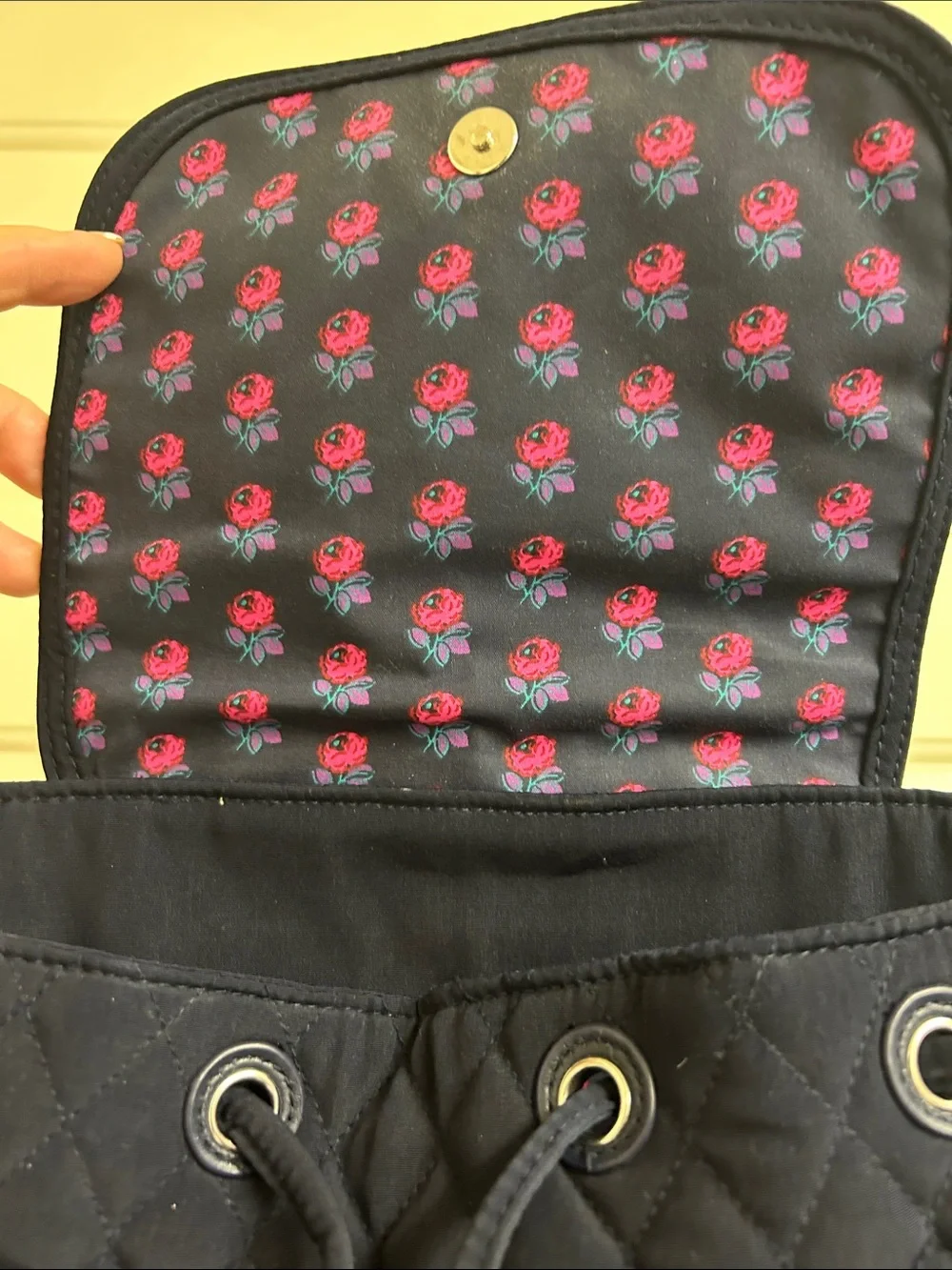 Vera Bradley quilted backpack in navy blue, diamond pattern a front flap closure